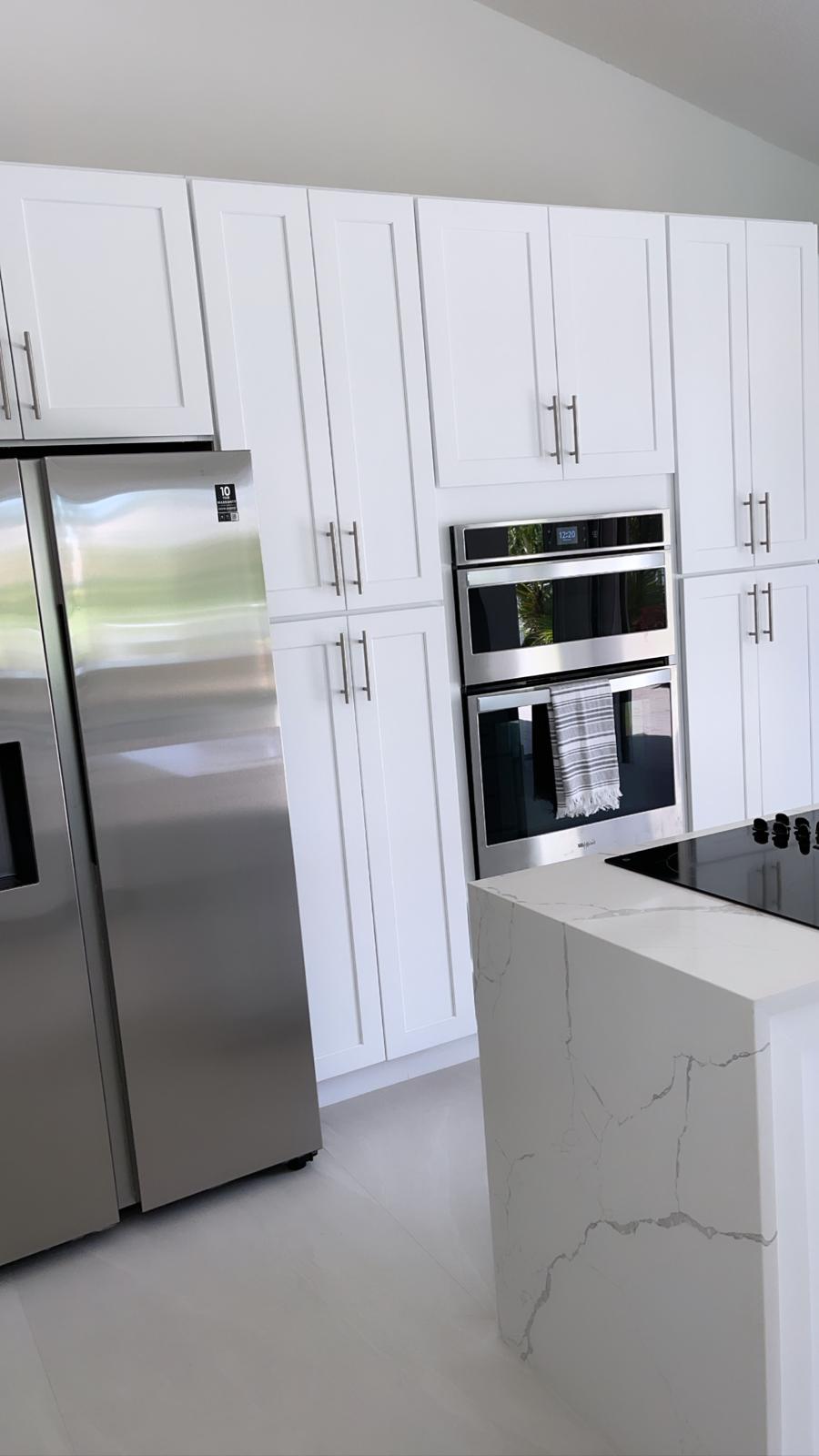 Kitchen refrigerator and ovens