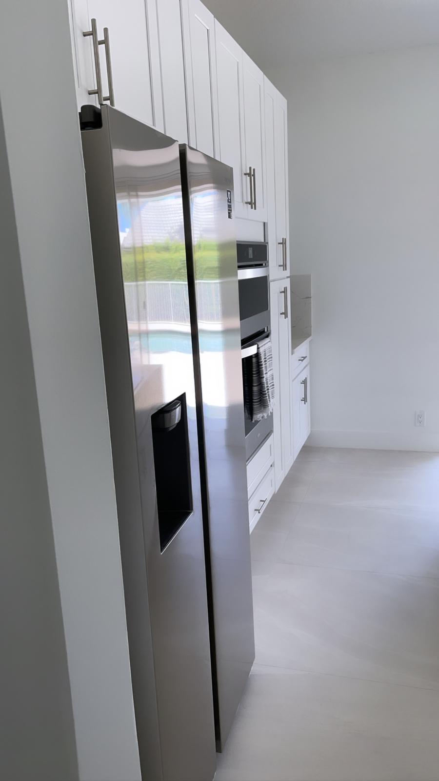 Kitchen side view with refrigerator